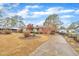 A well maintained single story home with mature trees and landscaping at 229 Davis Mill Rd, Selma, NC 27576