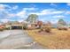 Well-maintained home with a long driveway and detached carport at 229 Davis Mill Rd, Selma, NC 27576