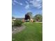 Attractive brick home featuring a manicured lawn, mature landscaping, and an inviting entrance at 229 Davis Mill Rd, Selma, NC 27576
