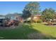 Charming brick home featuring mature landscaping and a well-manicured lawn at 229 Davis Mill Rd, Selma, NC 27576