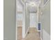 Hallway featuring a white door, lighting, and neutral-toned carpet at 229 Davis Mill Rd, Selma, NC 27576