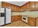 Traditional kitchen with wooden cabinets, offering plenty of storage and counter space at 229 Davis Mill Rd, Selma, NC 27576