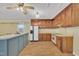 Charming kitchen with wood cabinets and flooring, with a large island for meal prep and entertaining at 229 Davis Mill Rd, Selma, NC 27576