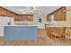Classic kitchen featuring wooden cabinetry, a spacious island, and updated appliances at 229 Davis Mill Rd, Selma, NC 27576
