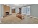 Open living room with a brick fireplace and large windows at 229 Davis Mill Rd, Selma, NC 27576