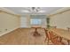 Living room with wood floors, dining tables, and large window at 229 Davis Mill Rd, Selma, NC 27576