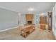 Bright living room featuring a brick fireplace and neutral walls at 229 Davis Mill Rd, Selma, NC 27576