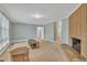 Spacious living room with fireplace and multiple doorways at 229 Davis Mill Rd, Selma, NC 27576