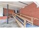 Wheelchair ramp with wooden railing and brick wall at 229 Davis Mill Rd, Selma, NC 27576