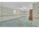 Empty room with light floral wallpaper and a ceiling fan at 229 Davis Mill Rd, Selma, NC 27576