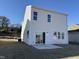 Backyard featuring a sliding glass door leading to a concrete patio at 350 Tormore, Homesite 126, Sanford, NC 27330