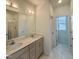 A bathroom featuring double sinks, tiled flooring, and recessed lighting at 350 Tormore, Homesite 126, Sanford, NC 27330