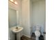 Half bathroom with a pedestal sink and modern fixtures at 350 Tormore, Homesite 126, Sanford, NC 27330