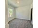 Comfortable bedroom features carpet and a bright window at 350 Tormore, Homesite 126, Sanford, NC 27330