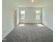 Spacious bedroom with two windows, carpet, and a closet at 350 Tormore, Homesite 126, Sanford, NC 27330