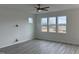 Spacious bedroom featuring three large windows and wood floors at 350 Tormore, Homesite 126, Sanford, NC 27330