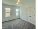 Bedroom with two windows and a double-door closet at 350 Tormore, Homesite 126, Sanford, NC 27330