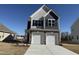 Charming two-story home with a two-car garage and stone accents at 350 Tormore, Homesite 126, Sanford, NC 27330