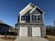 Charming two-story home with a two-car garage and stone accents at 350 Tormore, Homesite 126, Sanford, NC 27330