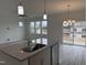Beautiful kitchen with stainless steel appliances, granite countertops, and island at 350 Tormore, Homesite 126, Sanford, NC 27330