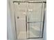 Glass enclosed shower stall with showerhead, seat and grab bar at 350 Tormore, Homesite 126, Sanford, NC 27330