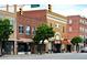 Street view with vintage brick buildings. Includes storefronts with large windows and street lamps at 350 Tormore, Homesite 126, Sanford, NC 27330