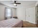 Bedroom with double doors, carpet, ceiling fan and window at 512 Drexel Rd, Rocky Mount, NC 27803