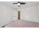 Bedroom with double doors, carpet, ceiling fan and window at 512 Drexel Rd, Rocky Mount, NC 27803