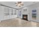 Comfortable living room featuring a fireplace and elegant built-in shelving at 9009 Grassington Way, Raleigh, NC 27615