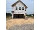 Under construction two-story home with a large garage, showcasing future charm and potential at 1011 Shovelhead Dr # 6, Durham, NC 27703