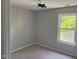 Bedroom featuring neutral colors, a window providing great natural light, and new carpet at 1017 Gaston Ave, Durham, NC 27707