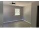 Bedroom featuring new carpet, large window allowing lots of natural light, and neutral colors at 1017 Gaston Ave, Durham, NC 27707