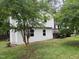 View of the two-story home with a landscaped yard, featuring a charming and well-maintained exterior at 1017 Gaston Ave, Durham, NC 27707