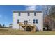 Back exterior of home showing a deck with steps and multiple double hung windows at 120 Tobacco Woods Dr, Youngsville, NC 27596