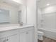 Bathroom featuring a sink, vanity, and shower-tub combination at 150 Whimbrel Ct, Lillington, NC 27546