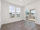 Cozy bedroom with a sliding door leading to a covered deck with backyard views at 150 Whimbrel Ct, Lillington, NC 27546