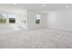 Large bonus room with carpeted floors and bright windows at 150 Whimbrel Ct, Lillington, NC 27546