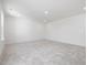 Large bonus room with carpeted floors and neutral paint at 150 Whimbrel Ct, Lillington, NC 27546