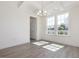 Dining room with coffered ceiling, modern chandelier, and large windows at 150 Whimbrel Ct, Lillington, NC 27546