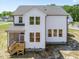 Back of home with a screen porch overlooking the backyard at 150 Whimbrel Ct, Lillington, NC 27546