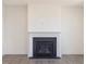 A close up view of the fireplace that features a dark firebox and white mantel at 150 Whimbrel Ct, Lillington, NC 27546