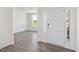 Bright foyer with white walls, luxury vinyl plank flooring, and a modern front door with sidelights at 150 Whimbrel Ct, Lillington, NC 27546