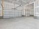 Spacious three-car garage with unfinished drywall at 150 Whimbrel Ct, Lillington, NC 27546