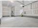 Spacious garage featuring concrete floor and water heater at 150 Whimbrel Ct, Lillington, NC 27546