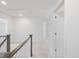 Upstairs hallway featuring neutral carpet and white trim at 150 Whimbrel Ct, Lillington, NC 27546