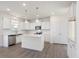 Beautiful kitchen features white cabinets, hardwood floors and stainless steel appliances at 150 Whimbrel Ct, Lillington, NC 27546