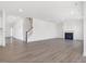 Bright and airy living room featuring a fireplace and modern flooring at 150 Whimbrel Ct, Lillington, NC 27546