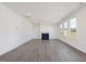 Bright living room features a fireplace, recessed lighting, and hardwood style floors at 150 Whimbrel Ct, Lillington, NC 27546