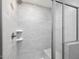 Walk-in shower with tile surround, shower bench, and a shower niche at 150 Whimbrel Ct, Lillington, NC 27546