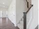 Entryway staircase featuring modern railing at 150 Whimbrel Ct, Lillington, NC 27546